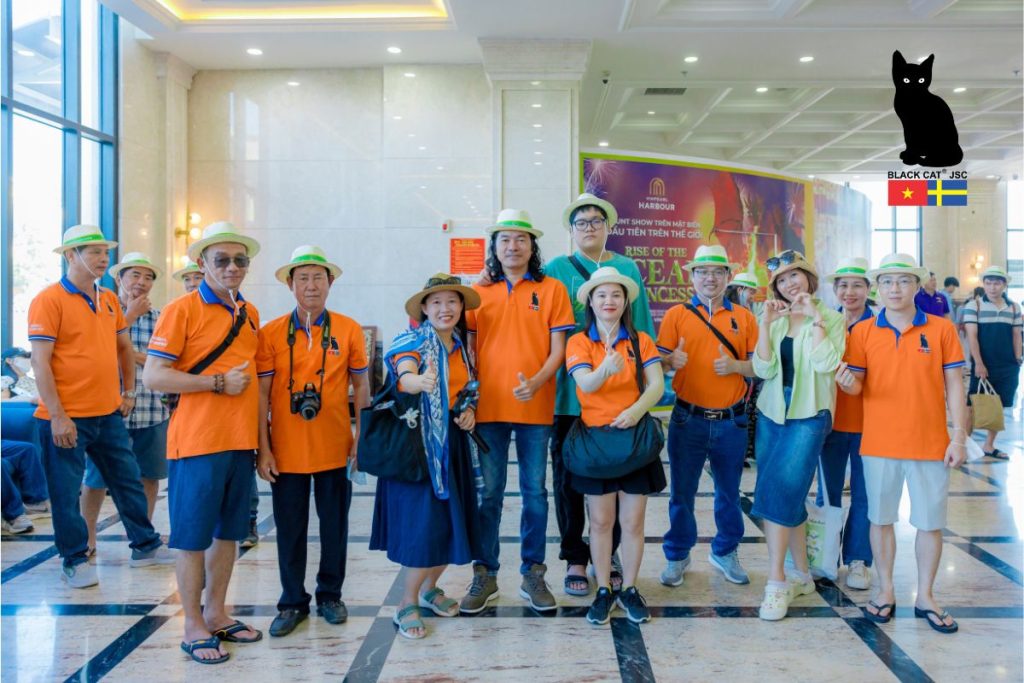 Black Cat JSC employees posing for a commemorative photo at the VinWonders Nha Trang complex