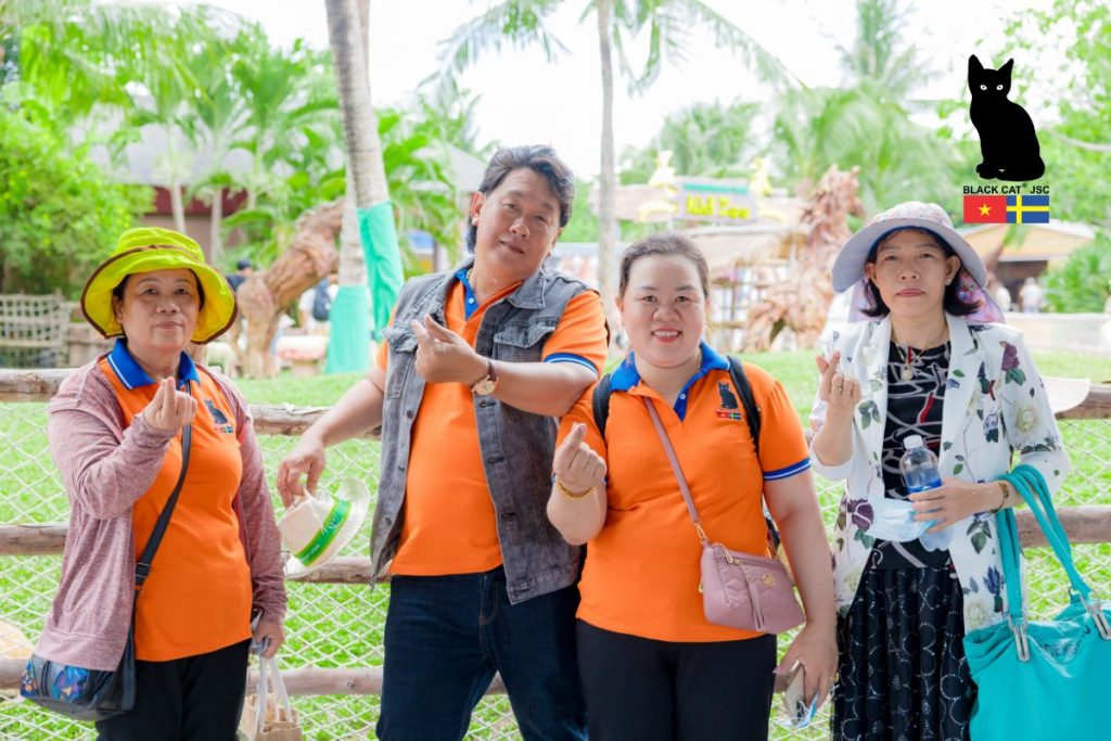 Black Cat JSC employees posing for a commemorative photo at the VinWonders Nha Trang complex