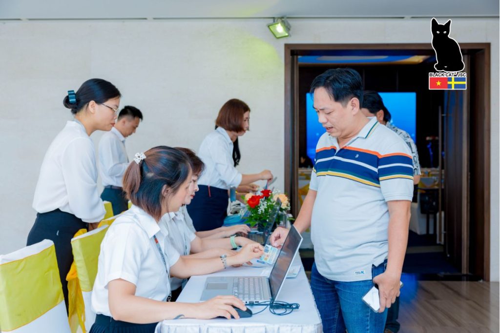 Shareholder check-in and document distribution at the 2025 Annual General Meeting of Shareholders.