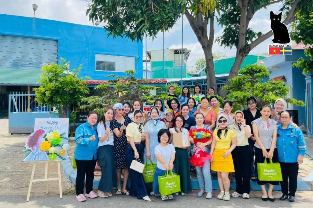 Female employees of Black Cat JSC take a commemorative photo on the occasion of International Women’s Day (March 8).