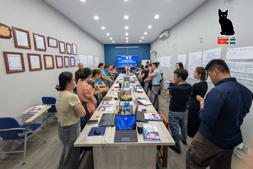A focused and engaging atmosphere during the internal training session on applying KPIs in work performance evaluation.