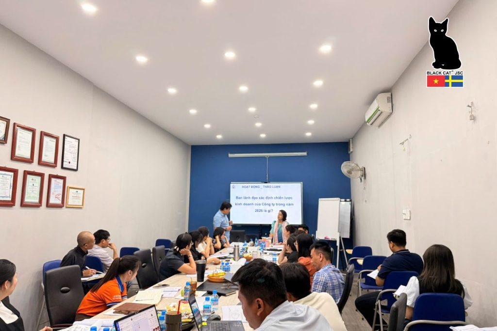 A focused and engaging atmosphere during the internal training session on applying KPIs in work performance evaluation.